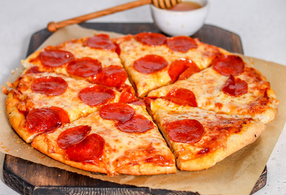 Hot honey pepperoni pizza sliced